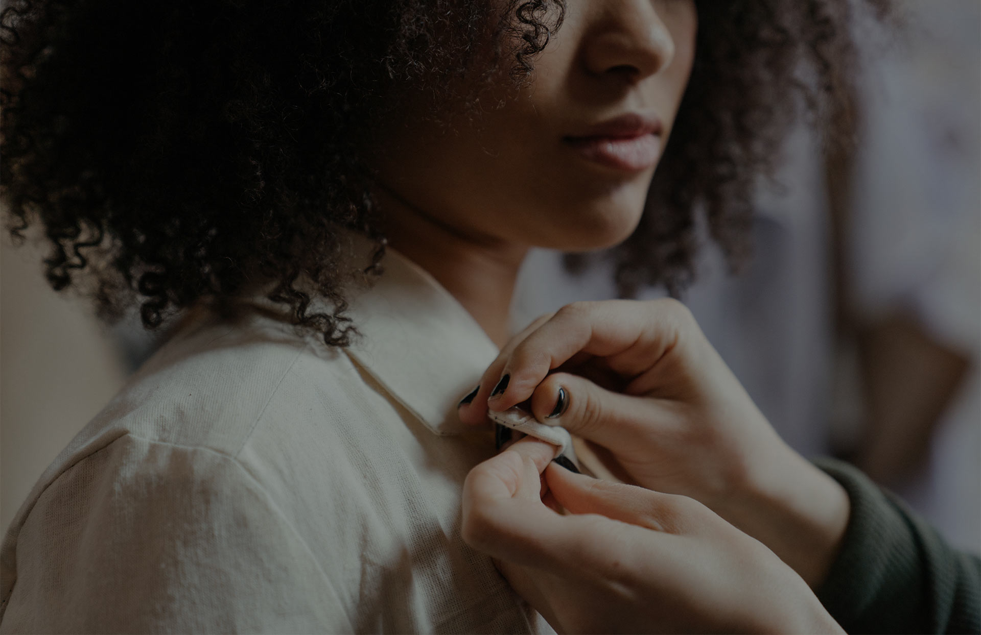 Expert hand-stitching on fine fabric